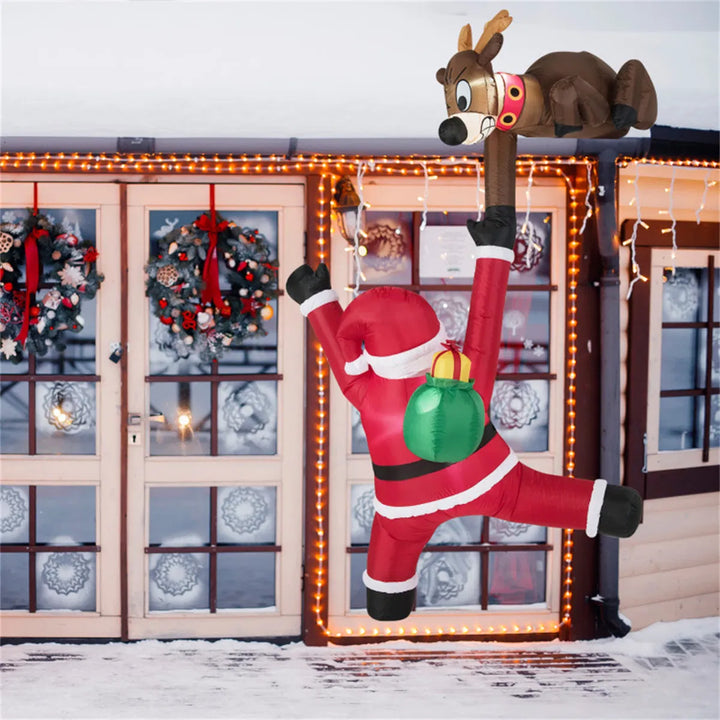 Opblaasbare kerstman met rendier die omhoog klimt