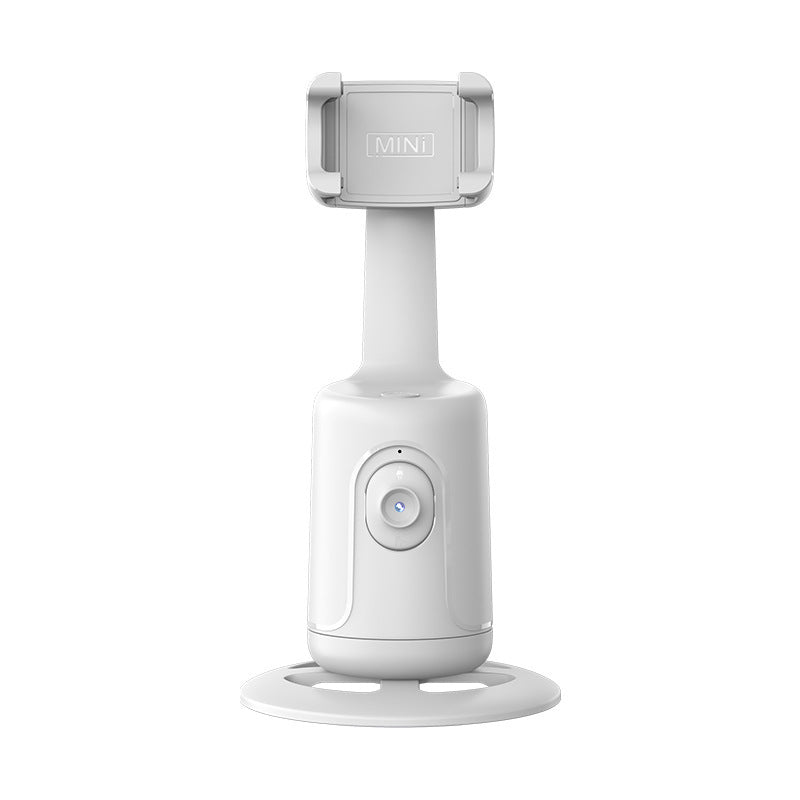 Witte telefoonhouder met gezichtsherkenning op tafel