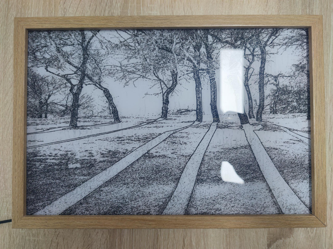 Verlicht schilderij met zonlicht door een raam
