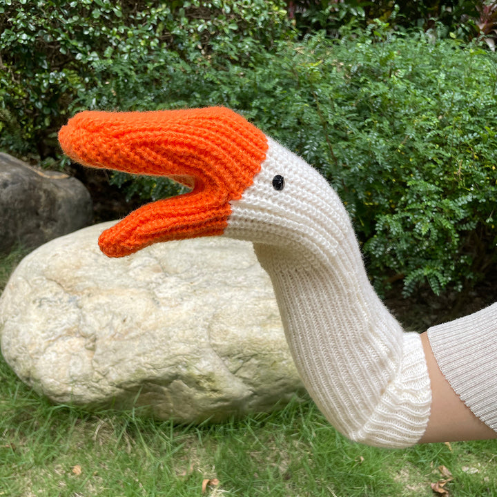 Gebreide wanten in de vorm van een gans