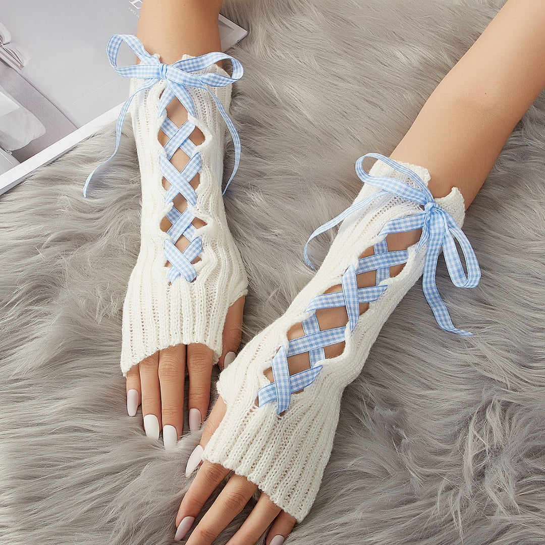 Lange witte armwarmers met geregen lint