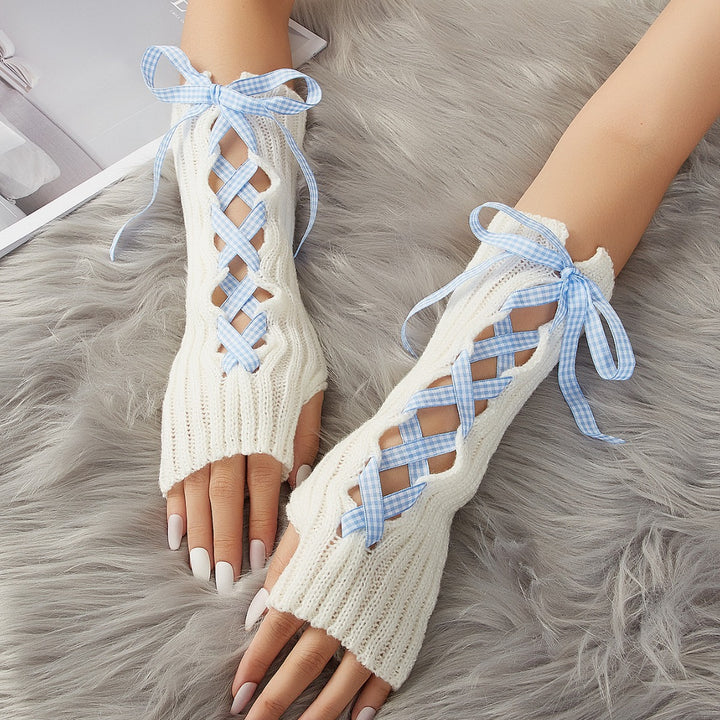 Lange witte armwarmers met geregen lint