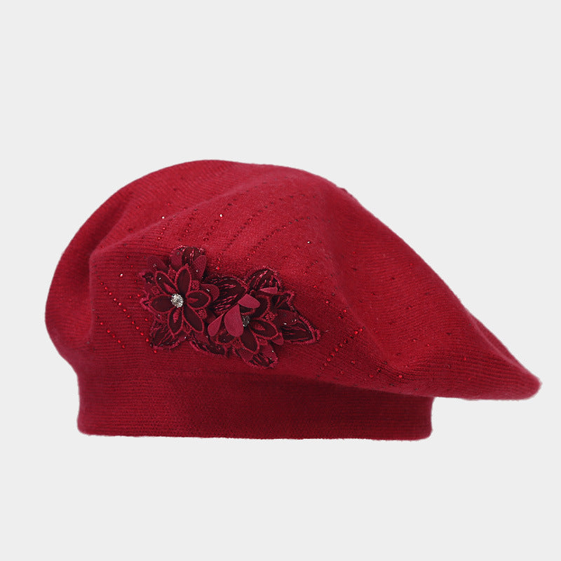 Gebreide baret met bloem en strass