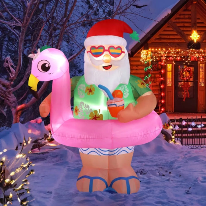 Opblaasbare kerstman op roze flamingo