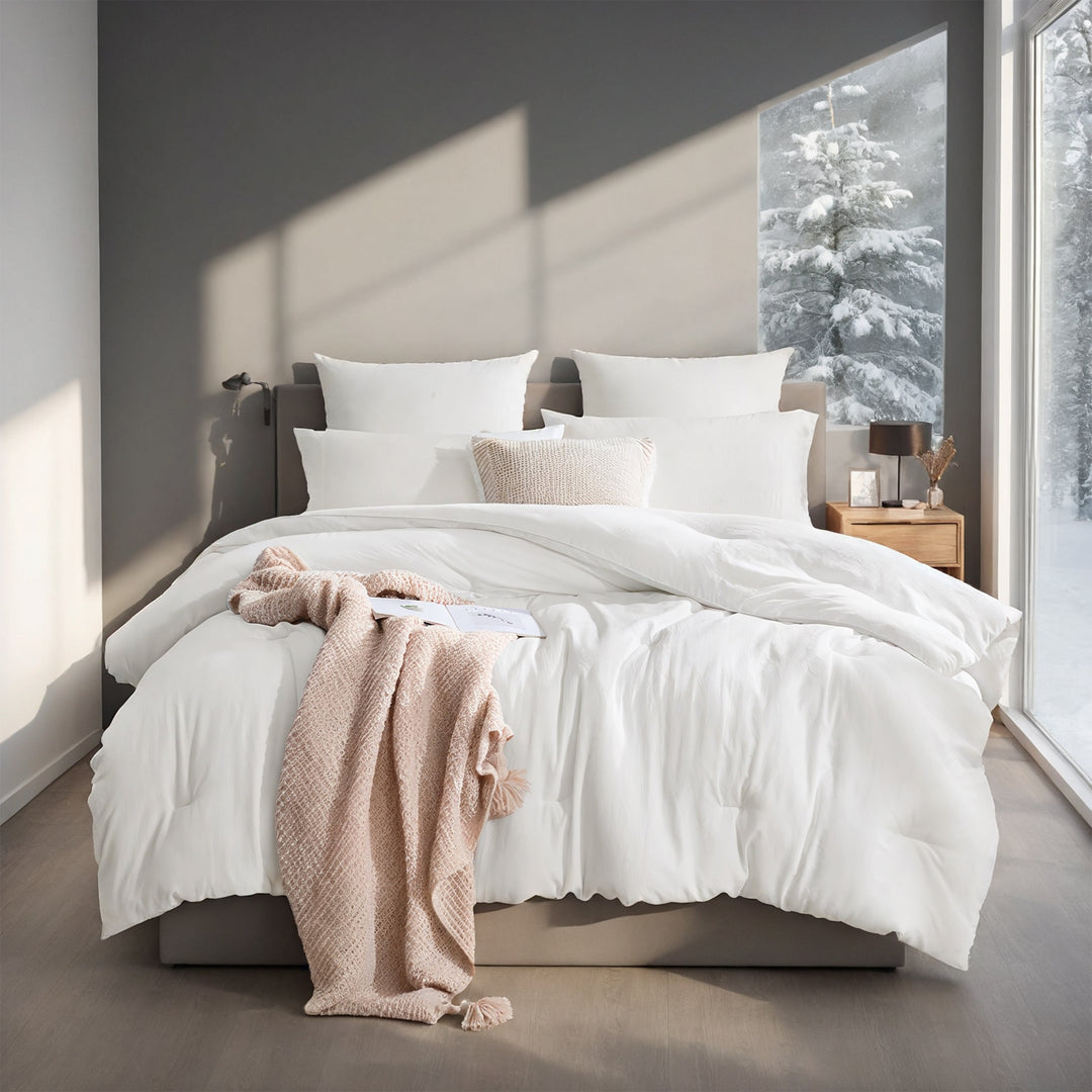 Wit dekbed met vakverdeling op bed