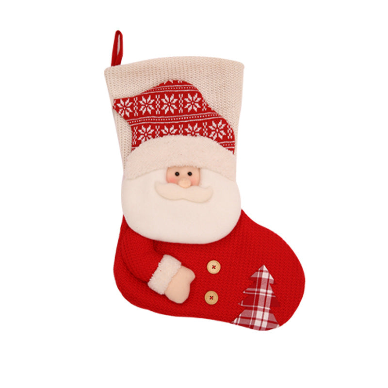 Gebreide kerstsok met kerstman of sneeuwpop