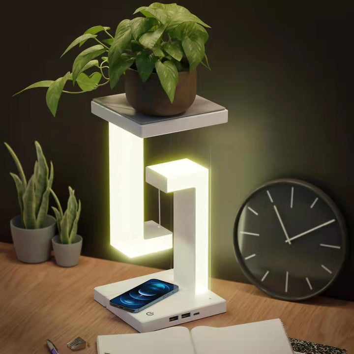 Witte zwevende lamp met telefoon op voet