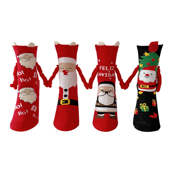 Twee kerstsokken met magnetische handjes