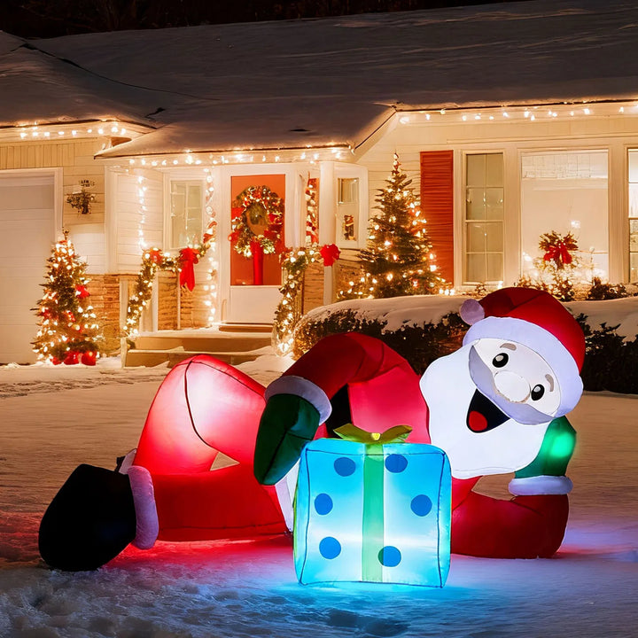 Opblaasbare liggende kerstman met cadeau