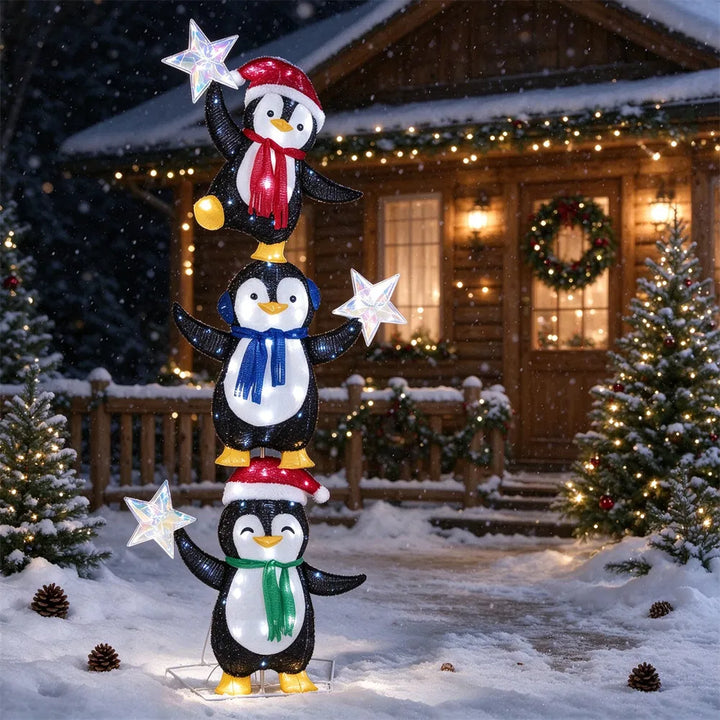 Verlichte figuur met drie pinguïns