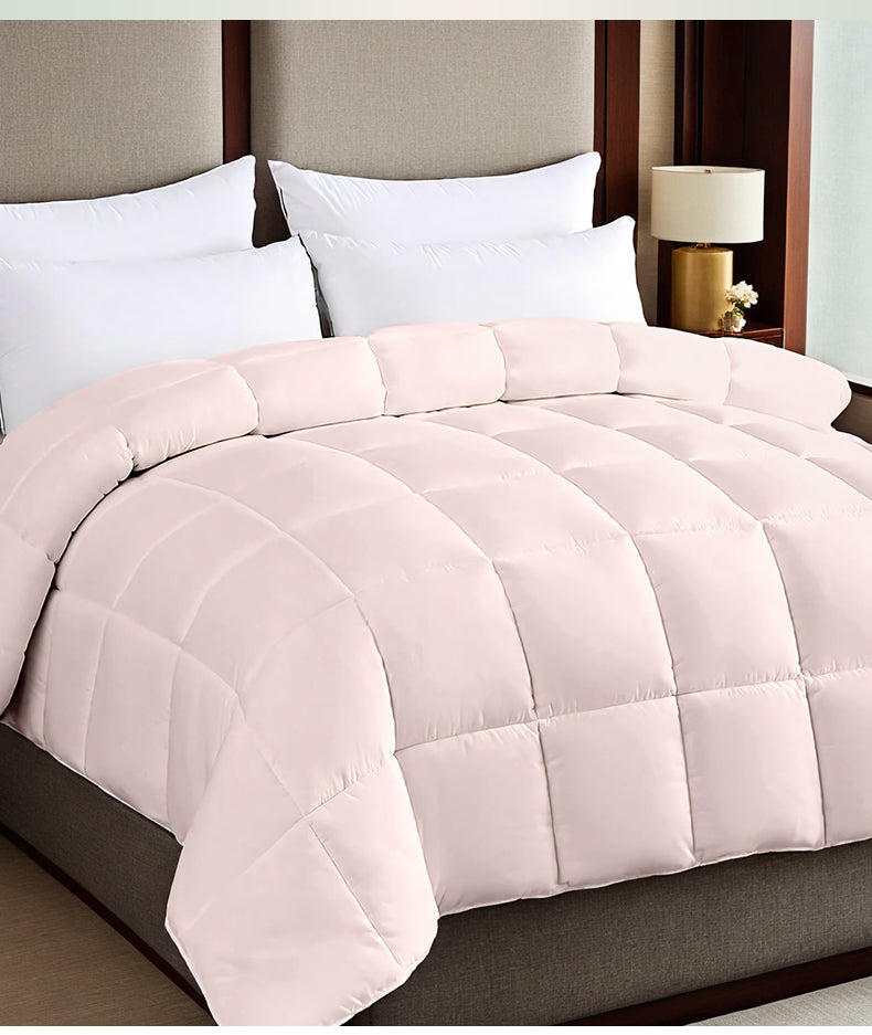 Roze dekbed met vakverdeling op bed