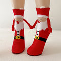 Twee kerstsokken met magnetische handjes