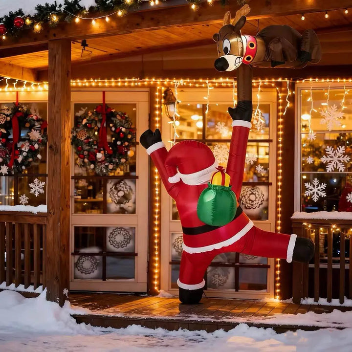 Opblaasbare kerstman met rendier die omhoog klimt