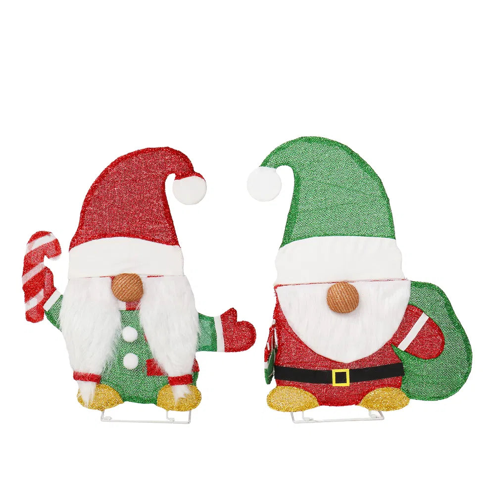 Twee verlichte kerstkabouters in de tuin