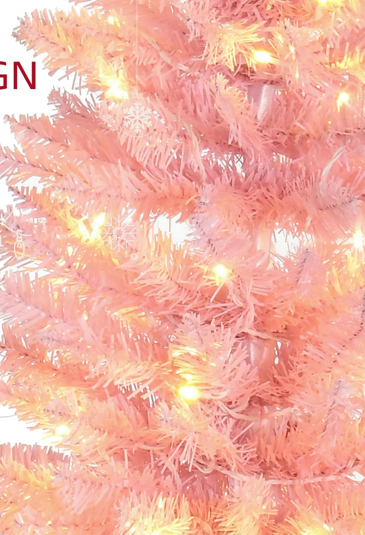 Roze slanke kerstboom met warme lampjes