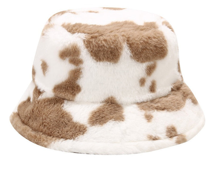 Pluizige bucket hat met koeienprint