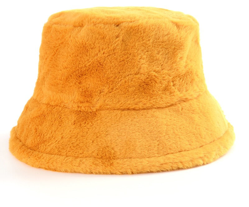 Pluizige bucket hat met koeienprint