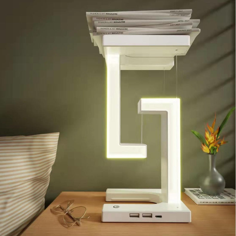 Witte zwevende lamp met telefoon op voet