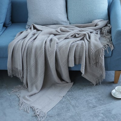 Gebreide plaid met streepstructuur en geknoopte franjes