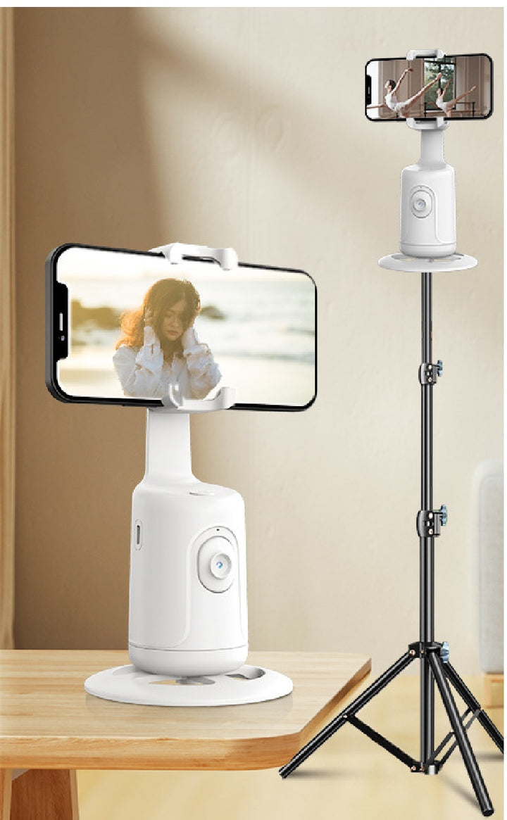 Witte telefoonhouder met gezichtsherkenning op tafel