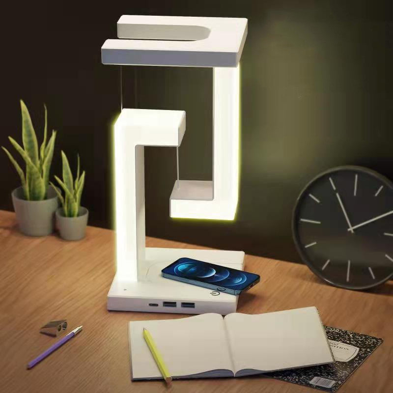 Witte zwevende lamp met telefoon op voet