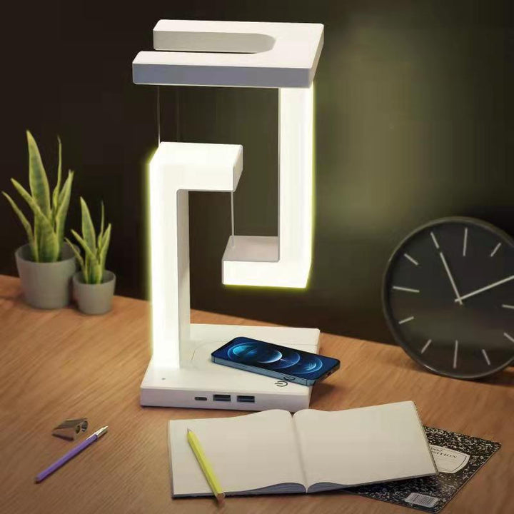 Witte zwevende lamp met telefoon op voet