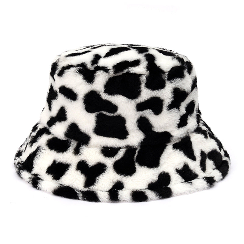 Pluizige bucket hat met koeienprint