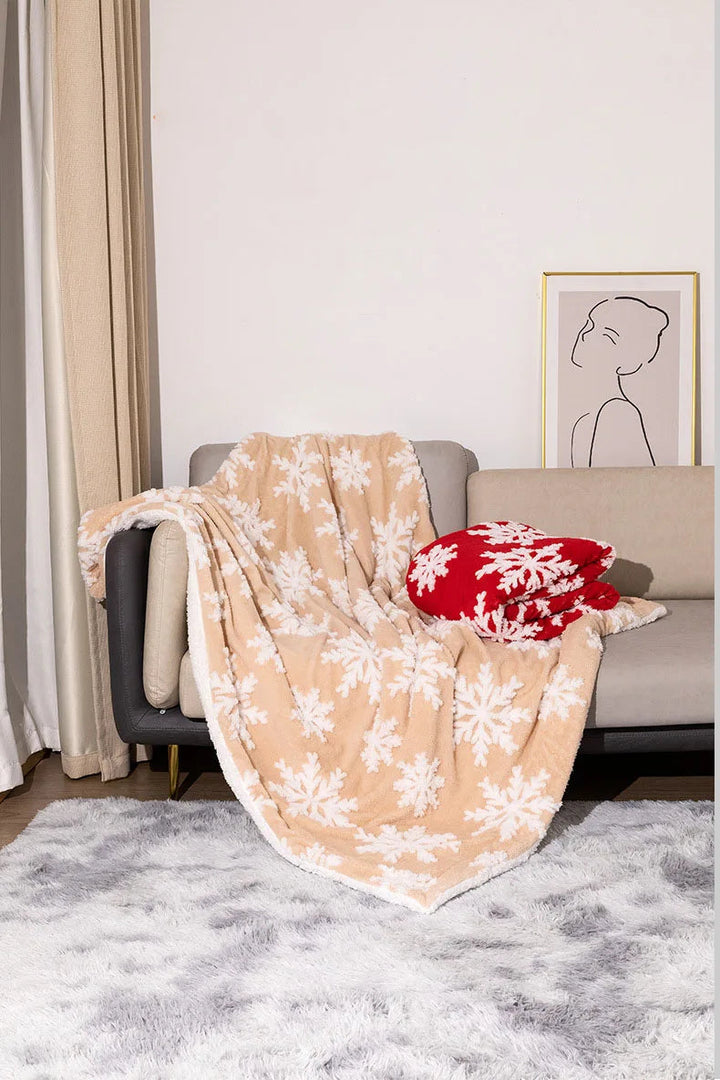 Wollen kerstplaid met sneeuwvlokken voor bank en bed