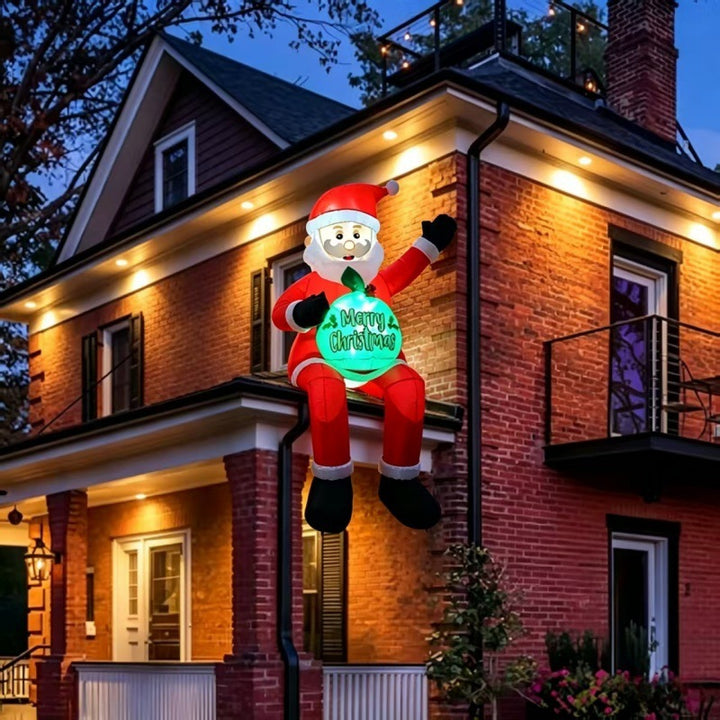 Opblaasbare kerstman met cadeauzak in tuin