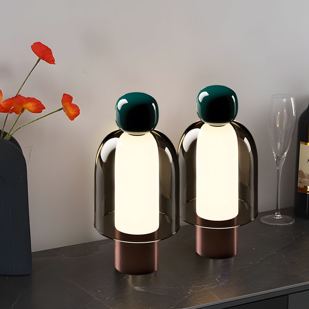 Draagbare glazen LED-tafellamp met figuursilhouet en metalen voet